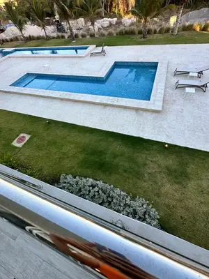 an overhead view of a swimming pool in a yard at LUXURY CONDO Cana Bay 1 CLUB BEACH in Punta Cana