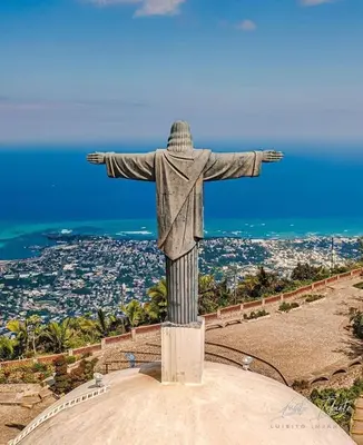 a statue of christ the redeemer on top of a hill at J&W apartment in San Felipe de Puerto Plata