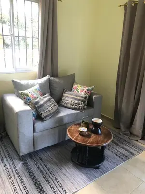 a living room with a couch and a coffee table at J&W apartment in San Felipe de Puerto Plata