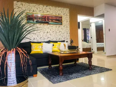 a living room with a couch and a coffee table at Ocean View Apart. In Down town in San Felipe de Puerto Plata