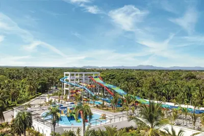 an aerial view of a water park with a roller coaster at Riu Palace Bavaro - All Inclusive in Punta Cana