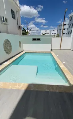 a swimming pool on the roof of a building at Bridget Place in Bayahibe