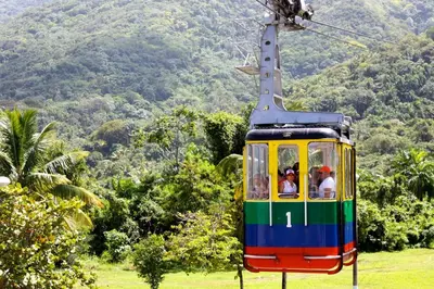 a cable car with people riding on it at LA CASA DE MAMA LUZ in San Felipe de Puerto Plata