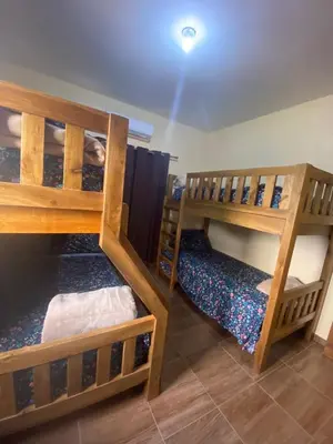 a room with two bunk beds in a room at VillaLunaCaridad in Jarabacoa