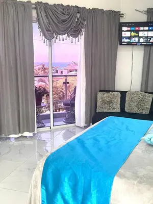 a bedroom with a bed and a large window at Royal Terrace V (Duque) in San Felipe de Puerto Plata